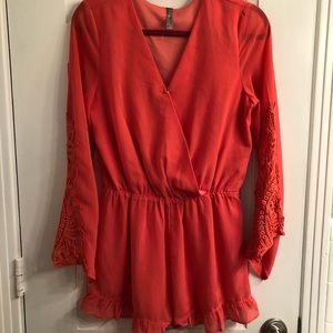 Coral romper with lacey sleeves